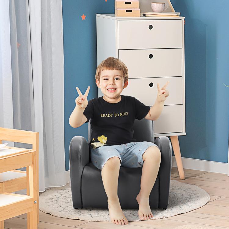 Grey toddler rocking chair with cushioned arms, child sitting and smiling