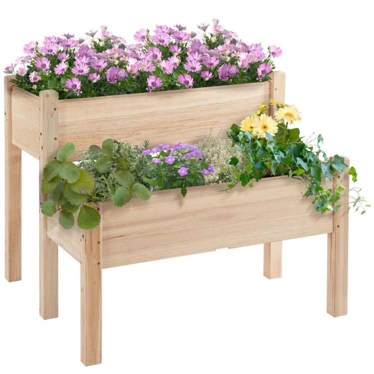 Two-tier raised wooden planter bed with pink and purple flowers