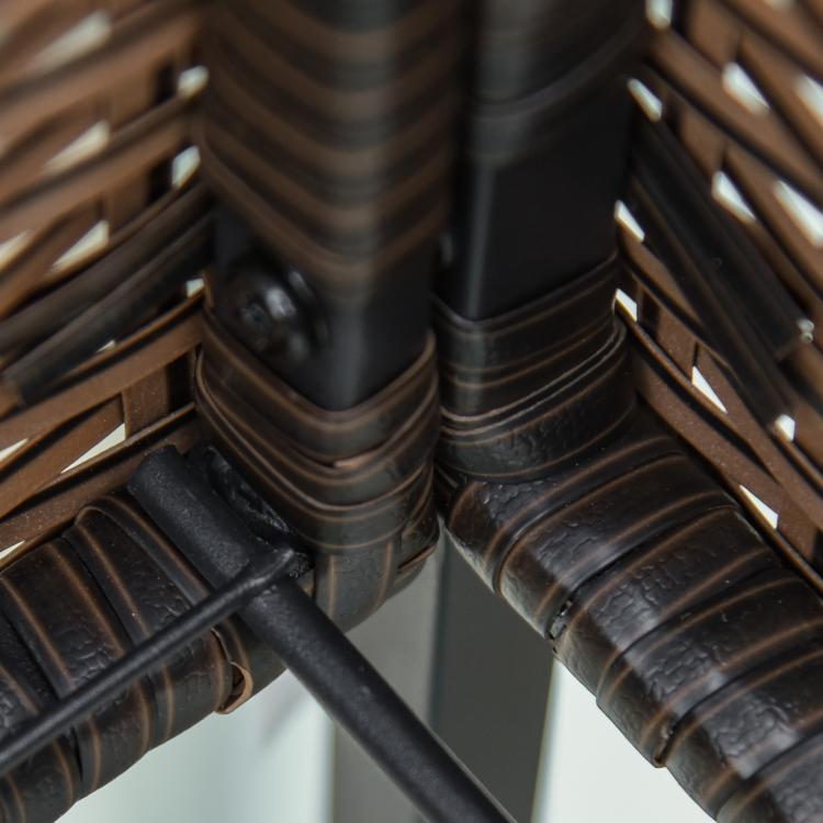 Close-up of brown rattan-style wicker weave on an elevated planter box