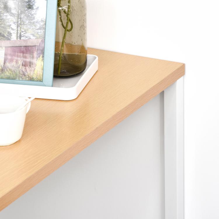 Counter-height dining table with light wood top and white side frame, open shelf detail