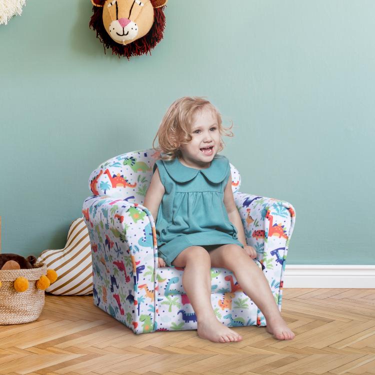 Kids dinosaur print sofa armchair with thick cushioning, child sitting in the padded seat