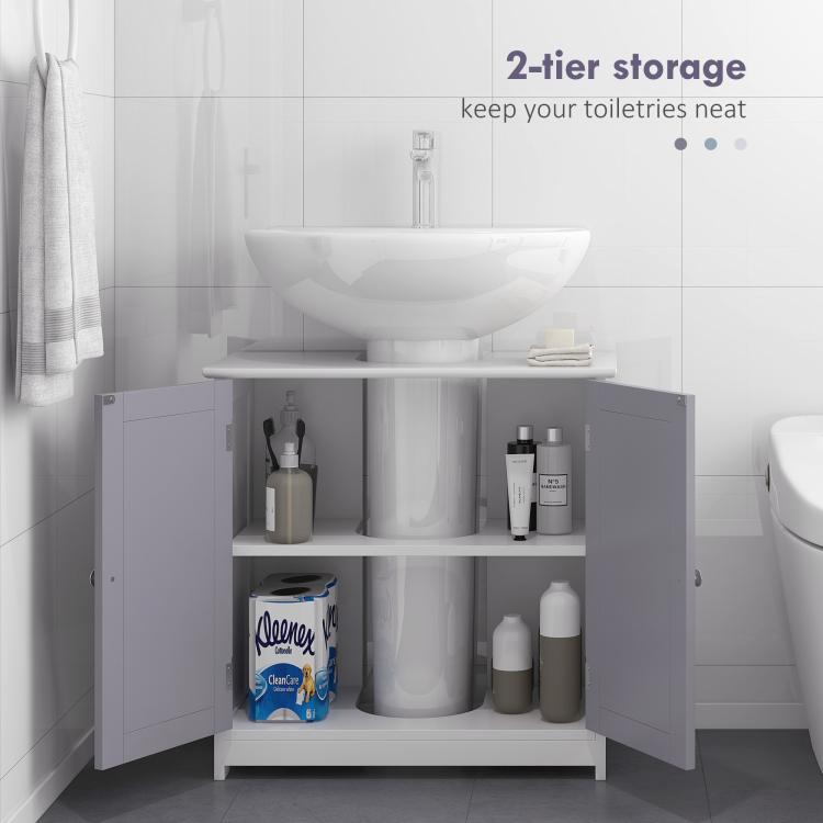 Bathroom storage cabinet open to show two adjustable shelves with bottles and supplies