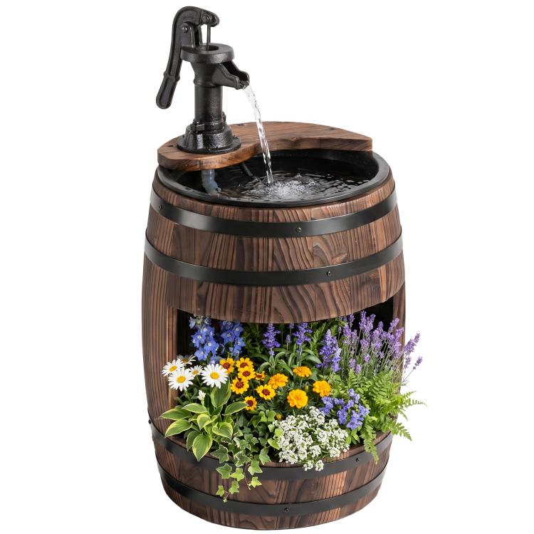 Rustic wooden barrel water fountain with black pump and overflowing stream, floral planter