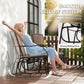 Rocking patio chair with smooth gliding arms and brown sling seat for gentle back-and-forth