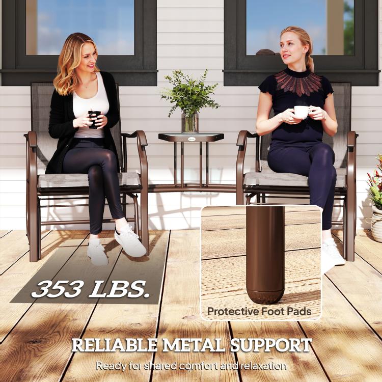 Outdoor rocking chair set with protective foot pads and brown sling seating plus coffee table