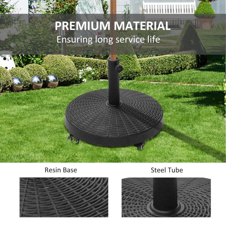 Black umbrella base stand on grass with resin base texture and steel tube support