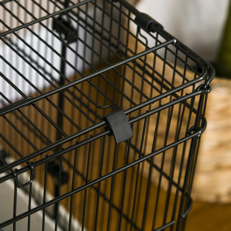 Black metal wire small animal cage with gray plastic latch near the door