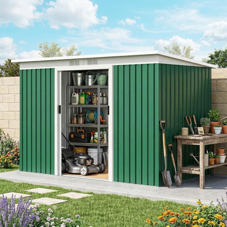 Dark green metal outdoor storage shed with side door open, tools and shelves inside