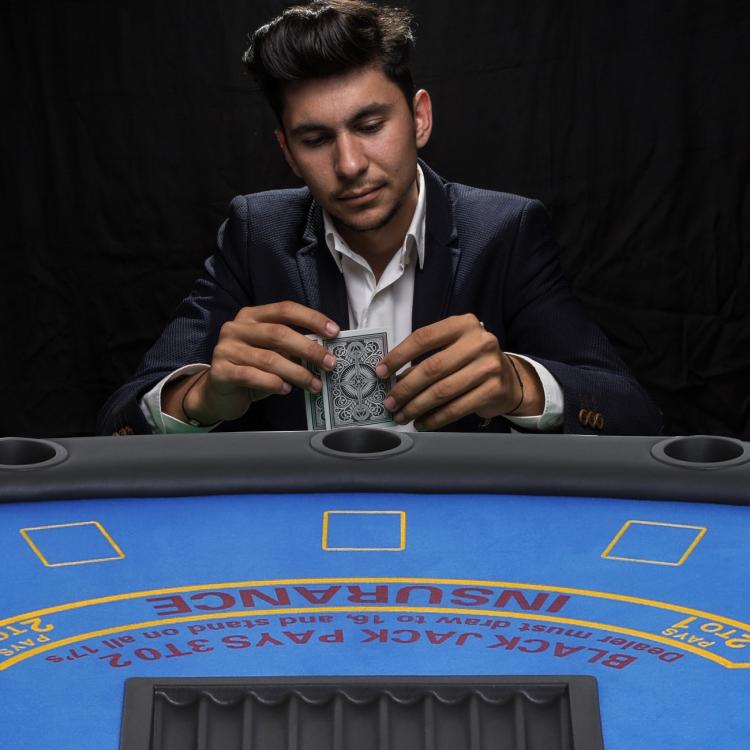 Poker table with blue felt, card tray opening, and circular cup holder wells