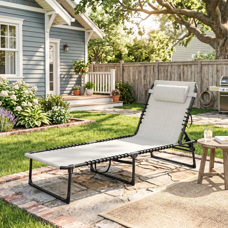 Folding chaise lounge chair with cream mesh seat, black frame, and padded headrest