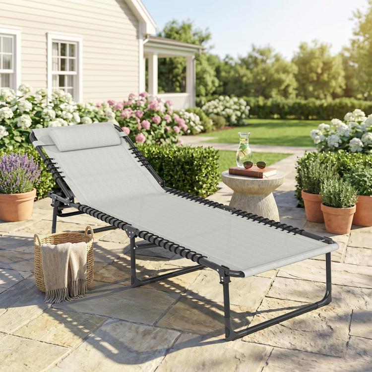Cream chaise lounge pool chair with pillow, breathable mesh seat, and black folding frame