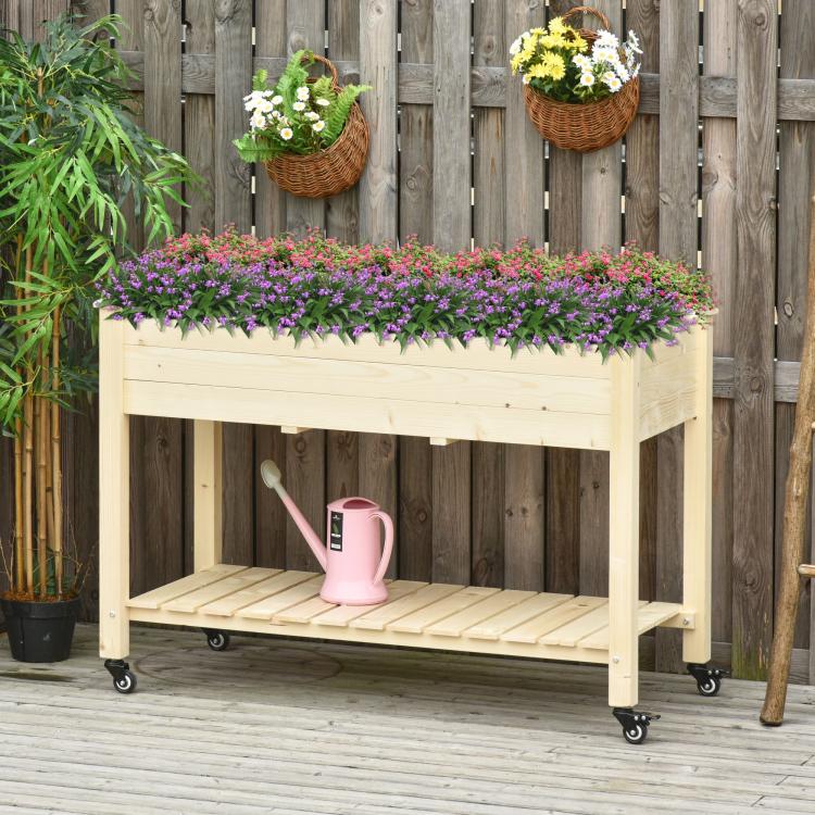 Raised wooden garden bed on rolling casters with lower shelf and plant liner