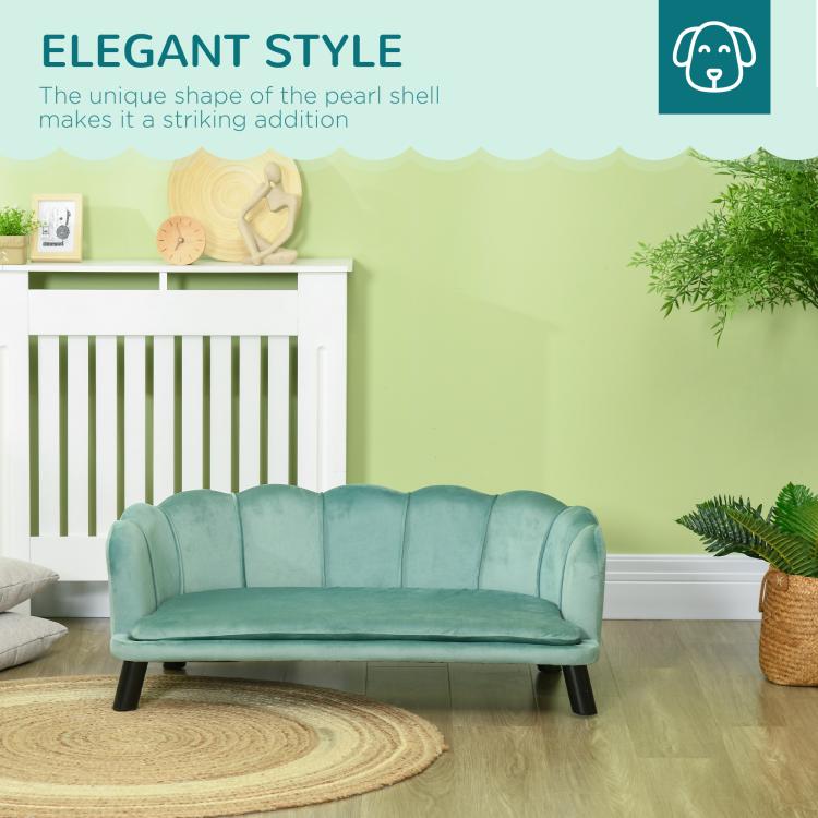 Green upholstered pet sofa bed with tufted back and padded seat, rounded arms