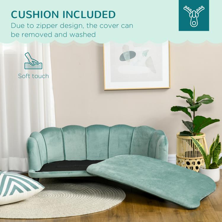 Green pet sofa bed with removable cushion insert laid on top of the seat