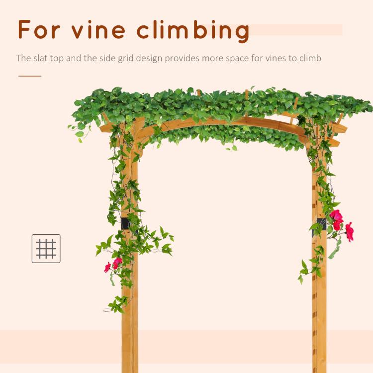 Wooden arch arbor trellis with leafy vine coverage and pink blossoms on side grid panels
