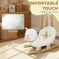 White plush rocking sheep toy with wide seat and soft body on wooden rockers.