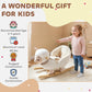 White plush rocking sheep toy with toddler standing beside on wooden rockers.