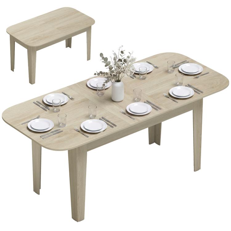 Light oak extendable oval dining table fully open with dining setting plates on top