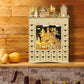 Wooden advent calendar with illuminated winter landscape window and 24 numbered drawers