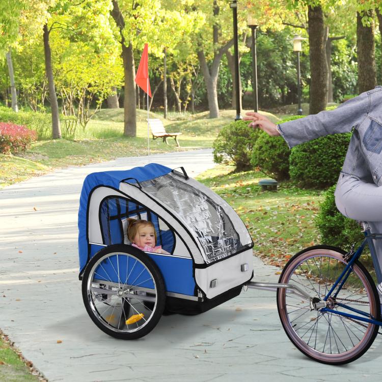 Two-seat child bike trailer with blue frame, clear front window, and tow bar