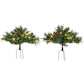Two 2 ft pre-lit artificial Christmas trees with warm white LED lights and red berries