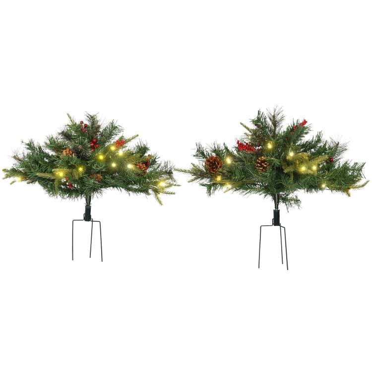 Two 2 ft pre-lit artificial Christmas trees with warm white LED lights and red berries