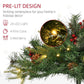 Pre-lit artificial Christmas tree branch with warm white lights, red berries, and pine cone