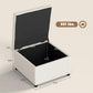 Beige storage ottoman bench with hinged flip-top lid open, showing black interior