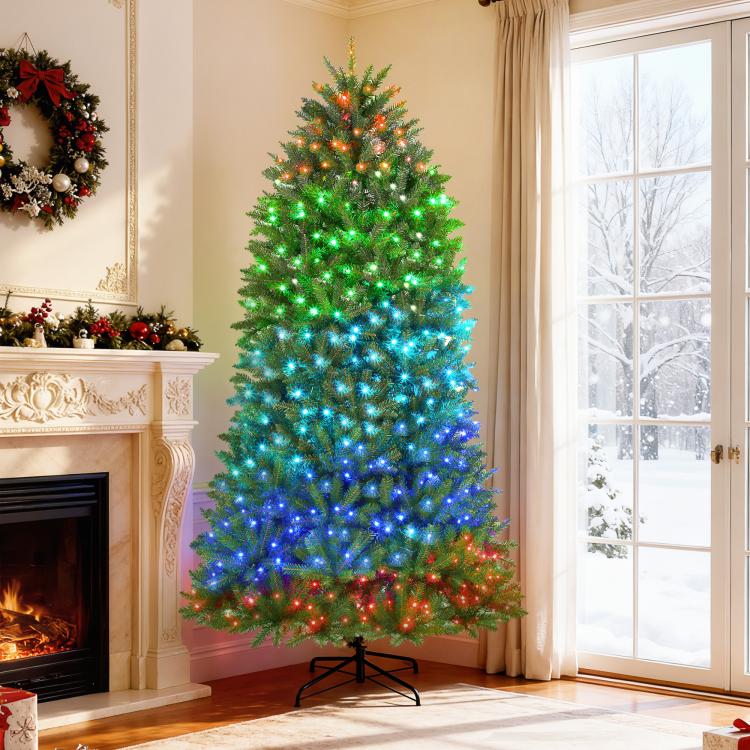 Prelit Christmas tree with green and blue LED lights and black metal stand