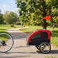 Red pet bike trailer stroller with black mesh sides and front window, two-wheel frame