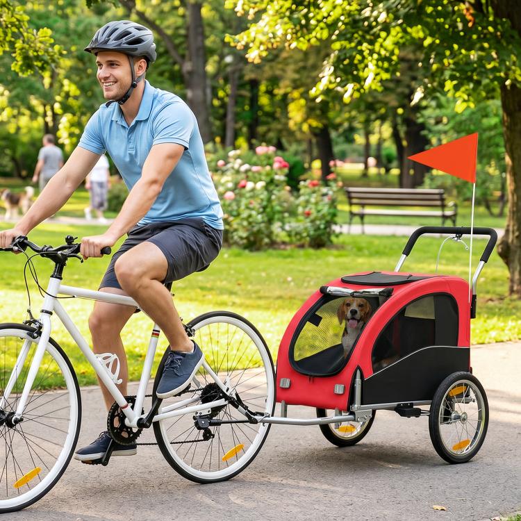 Red dog bicycle trailer with front mesh door window and suspension wheels
