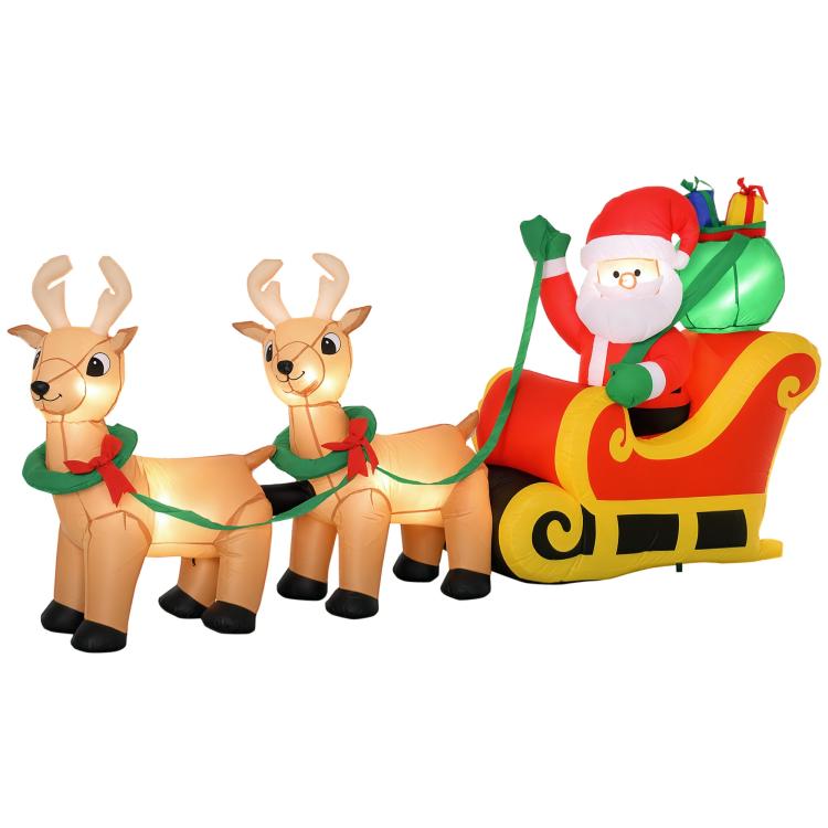 Inflatable Santa on red-and-yellow sleigh with two reindeer, green accents, LED glow