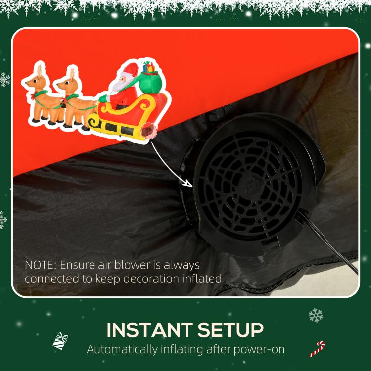Inflatable Christmas decoration with blower fan and power cord under sleigh scene