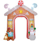 Inflatable candy house archway with “MERRY CHRISTMAS” banner and striped roof