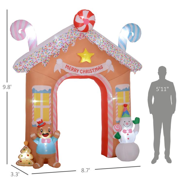 Candy house inflatable archway with gingerbread and snowman, shown with size diagram