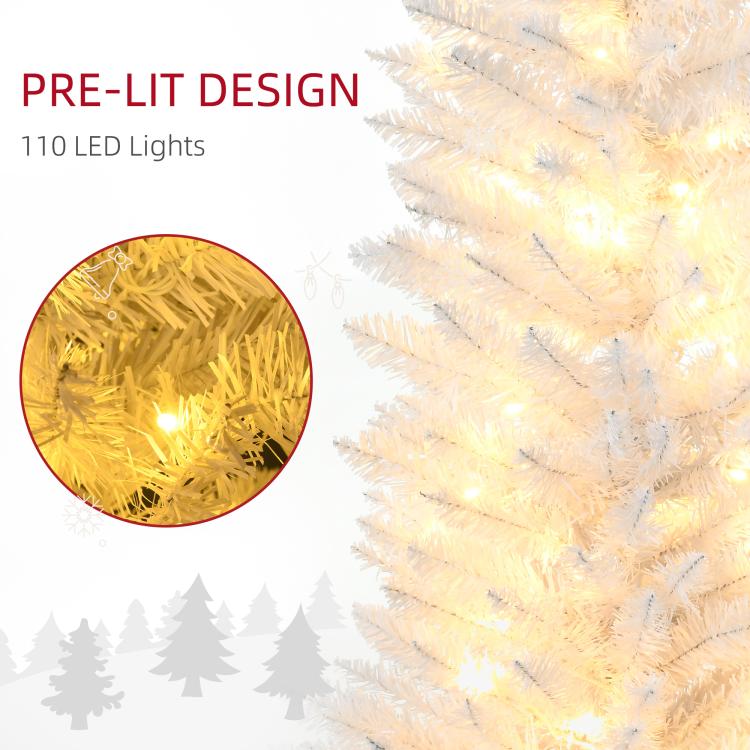 Pre-lit white artificial Christmas tree branches with warm white LED lights, close-up