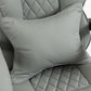 Light gray cushioned headrest with diamond-quilt stitching