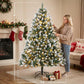 Frosted artificial Christmas tree with multicolor LED lights, being adjusted