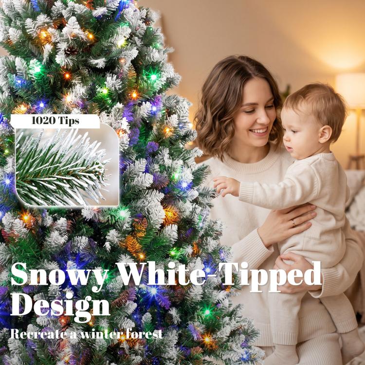 Frosted artificial Christmas tree with multicolor LED lights beside a family