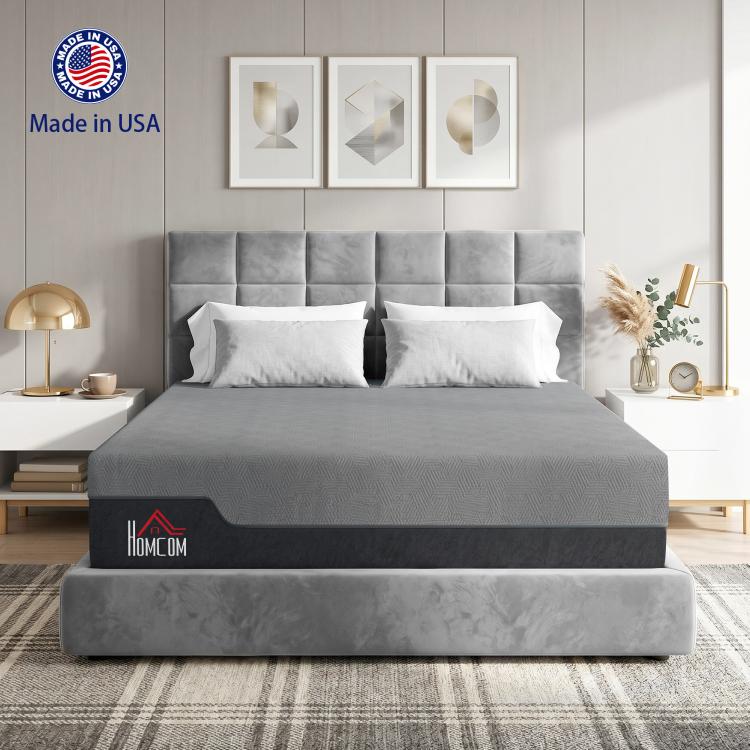 Grey queen memory foam mattress on bed frame with two pillows