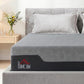 Grey queen memory foam mattress with dark side panel and light pillows