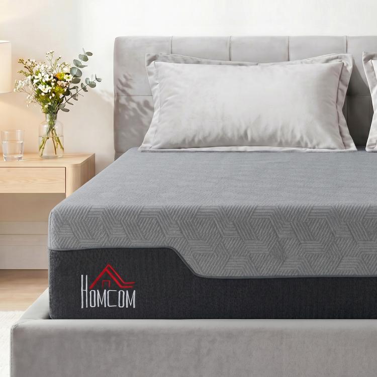 Grey queen memory foam mattress with dark side panel and light pillows
