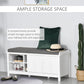 White shoe storage bench with gray cushioned seat and multiple shoe compartments
