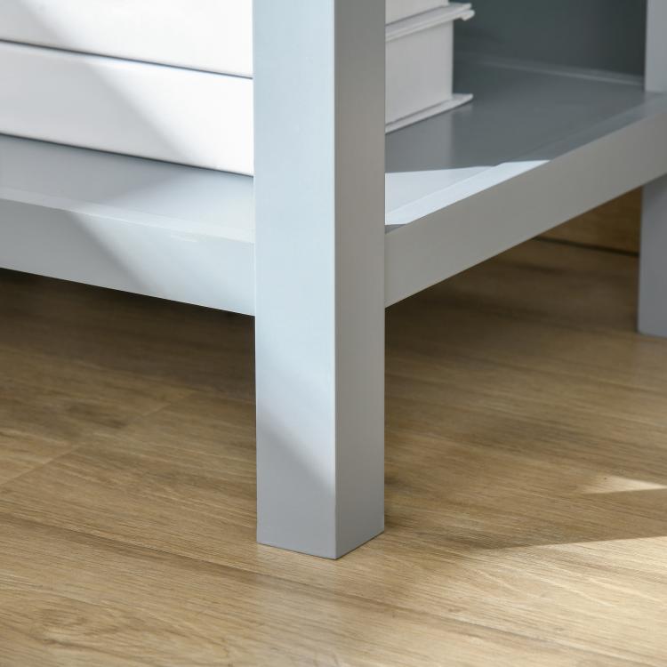 Light gray end table with storage drawer and lower shelf, straight legs
