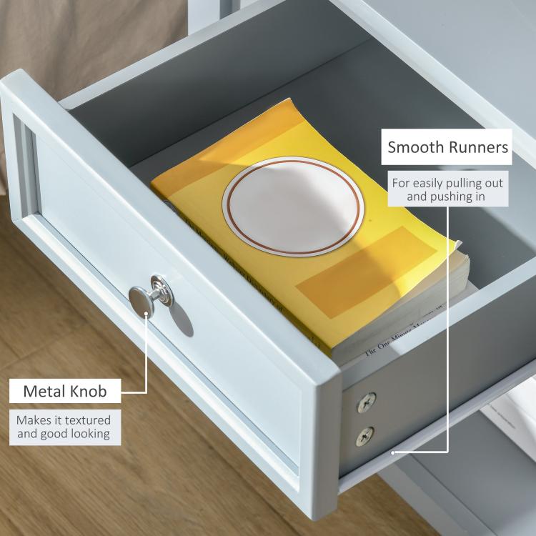 Light gray end table drawer with round metal knob and smooth runners