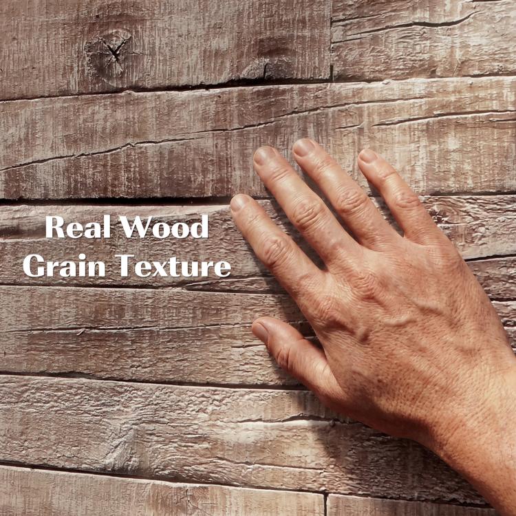 Gray faux wood plank texture with raised grain detail and a hand pressing the surface.