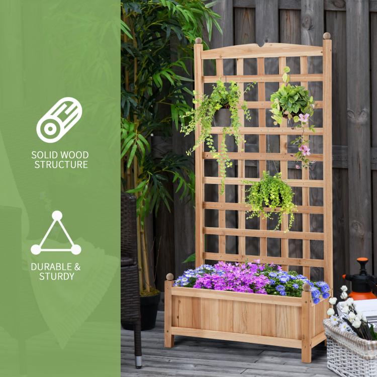 Wooden raised garden bed with trellis and stacked planters, purple flowers in base