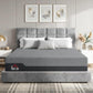 King-size memory foam mattress with gray cover on a bed, shown in a bedroom setting