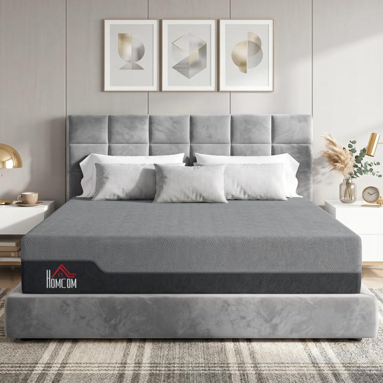 King-size memory foam mattress with gray cover on a bed, shown in a bedroom setting