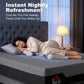King-size memory foam mattress with a person sleeping on it in a bedroom
